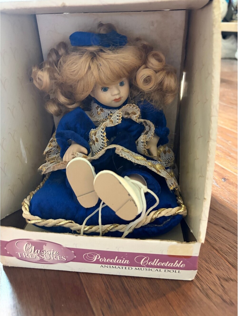 Classic Treasures Porcelain Collectable Animated Musical Doll in Blue Dress